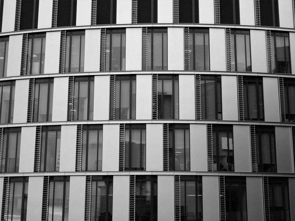 pexels-photo-946310-946310 Close-up view of a contemporary office building exterior with glass and steel elements.